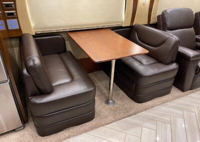 brown rv dinette booth inside a motorhome